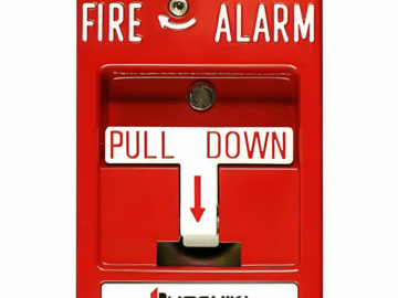 A person activating the Hochiki DCP-AMS manual pull station installed on a wall.